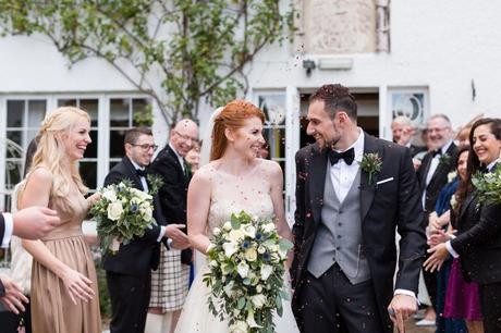 Confetti with rose petals with redheaded bride at Achnagairn Estate wedding