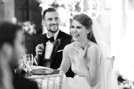 Bride smiling and laughing during speeches at Achnagairn Estate wedding