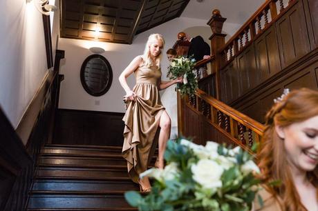 Bridemaids walk down wooden stairs at Achnagairn Estate