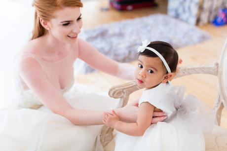 Bride with adorable little flower girl. 