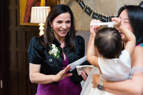 Guest smiling at flower girl. 