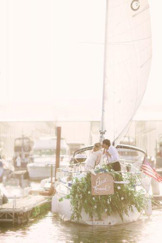wedding exit photo ideas boat with green leave Red Boat Photography