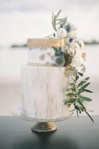 chic wedding cakes with golden touch and flowers blackbird photo