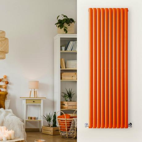 vertical orange radiator in a white bedroom