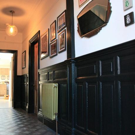 Gold column radiator in a dark hallway