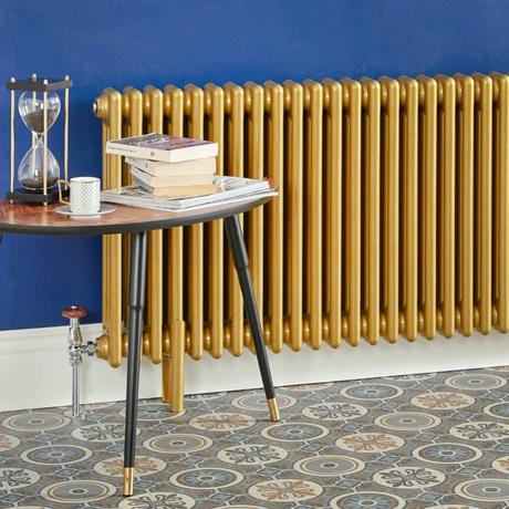 Gold radiator on a blue walll