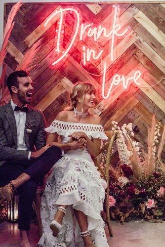 wedding trends 2019 bohemian wooden backdrop with neon romantic sign lilly red