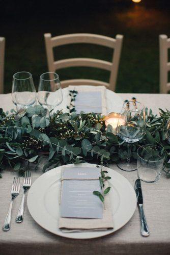 wedding trends 2019 white burlap tablecloth and greenery eucalyptus table runner with candles duepunti wedding photography