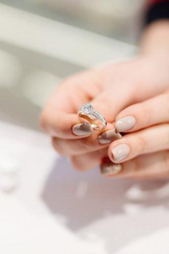 wedding trends woman holding diamond ring