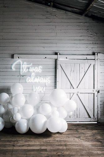 wedding trends 2019 white barn décor with balloons and romantic neon signs littlepineappleneon