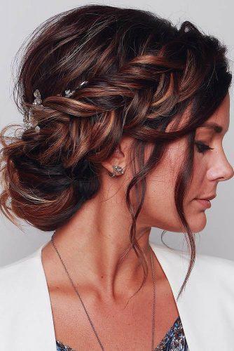 wedding trends 2019 elegant royal bun with side braid and loose curls blushandmane
