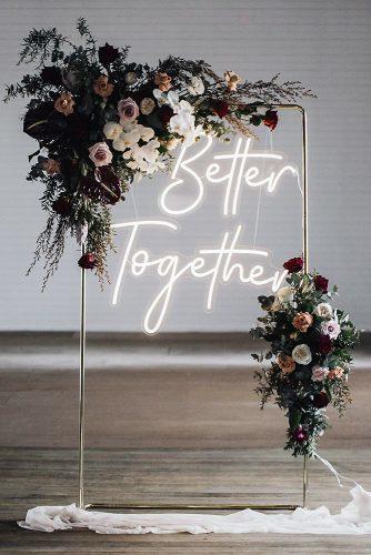 wedding trends 2019 minimalistic arch dark moody flowers and neon romantic sign littlepineappleneon