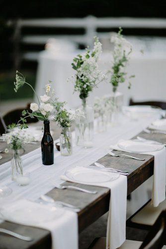 wedding trends 2019 minimalistic black white tablerunner centerpieces with flowers in glass brad and jen photography