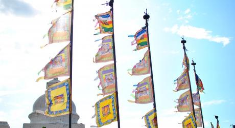 Flags fly high at the temple complex of Boudhanath in Nepal, Asia