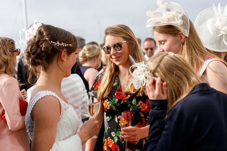 the bride reflected in a guests glasses at aldeburgh yacht club