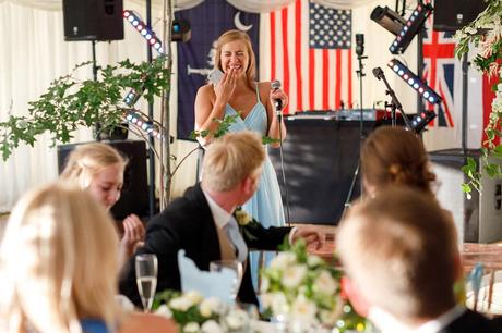 the brides sister laughs during her speech