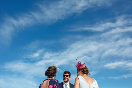 wedding guests under a summer sky