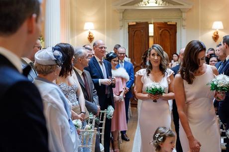 the bridemaids walk down the aisle at hedsor house