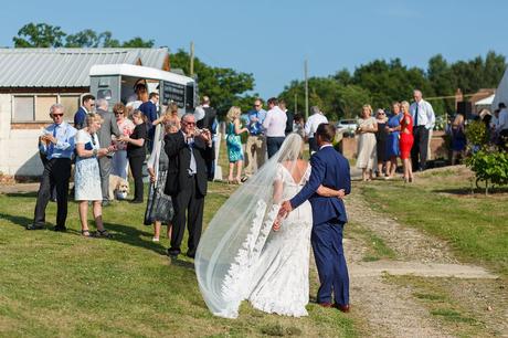 wedding guests take photos at a bluebell vineyard wedding