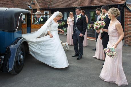 a bride glides from her vintage rolls royce