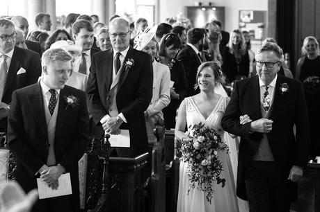 a bride catches sight of the groom in aldeburgh church
