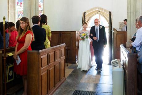 a bride and her father walk into pennard house church