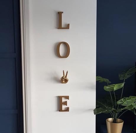 Love wall sign, using our peace hand hook as the letter V