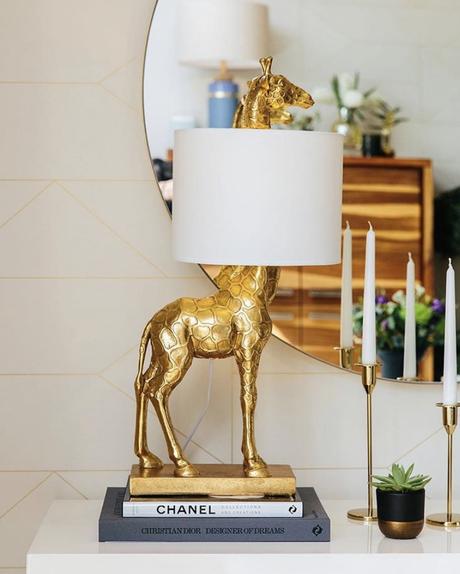 Hallway table styled with our gold giraffe table lamp 