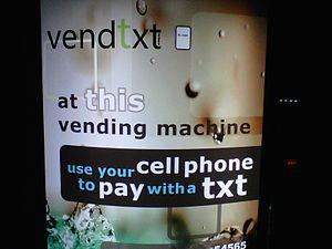 Vending machine that accepts payment with mobi...