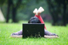 attractive-woman-using-laptop-outdoor
