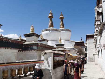 Buddhists circumambulating the three large chortens