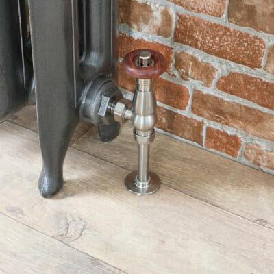 Milano Windsor thermostatic radiator valve entering a cast iron radiator