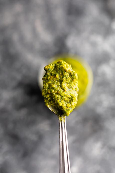 spoonful of creamy green sauce made from pistachios