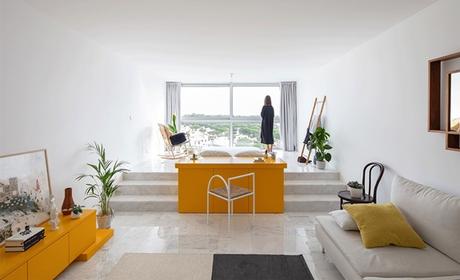 Breaking Conventional Architectural Norms in a Minimal White and Yellow Apartment Breaking Conventional Architectural Norms in a Minimal White and Yellow Apartment