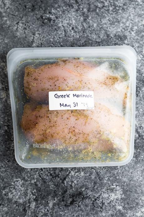 chicken marinating in a small reusable silicone bag