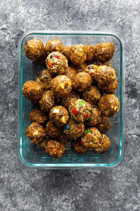 meal prep container overflowing with energy balls