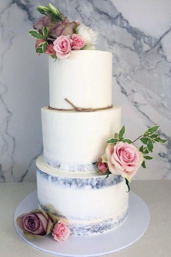 buttercream wedding cakes rustic tall white with pink roses and green leaves blondebakingmama via instagram