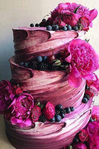 buttercream wedding cakes pink with blueberries and mulberries with flowers of peonies and roses stefani pollack via instagram