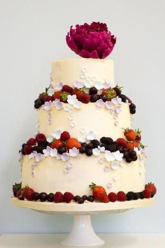 buttercream wedding cakes with berries and peony on top rosalindmillercakes via instagram