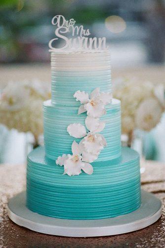 buttercream wedding cakes three tired white and blue ombre decorated with orchids j wilkinson co photography