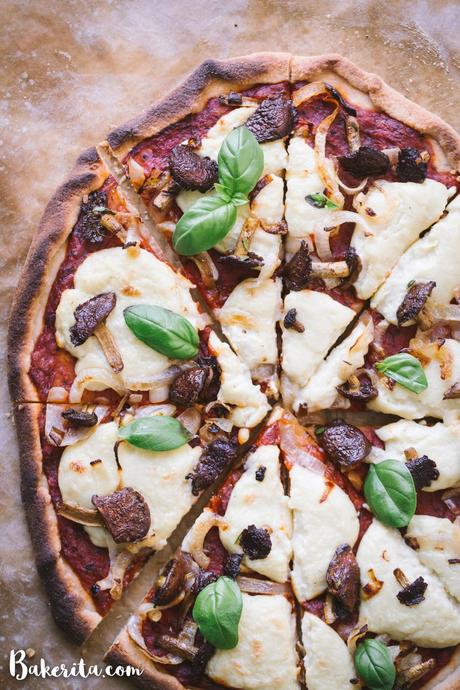 You'll be surprised at how easily this Gluten-Free Vegan Pizza with Mushrooms & Onions comes together! It is made with my new favorite gluten-free pizza crust and topped off with tomato sauce, homemade vegan mozzarella cheese, mushrooms and onions. Perfect for pizza night!