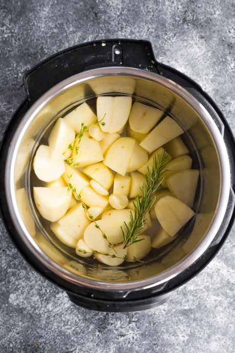 overhead view of potatoes and herbs in an instant pot