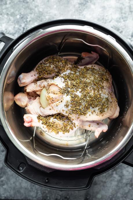 overhead view of a whole chicken in the instant pot