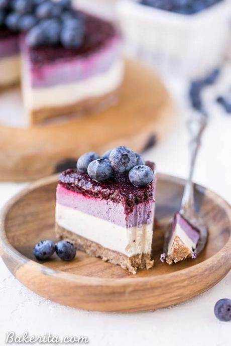 This No-Bake Layered Blueberry Cheesecake is a beautiful and easy-to-make Paleo-friendly + vegan cheesecake made with soaked cashews! The cheesecake layers are lusciously smooth and creamy with a tart, fruity topping.