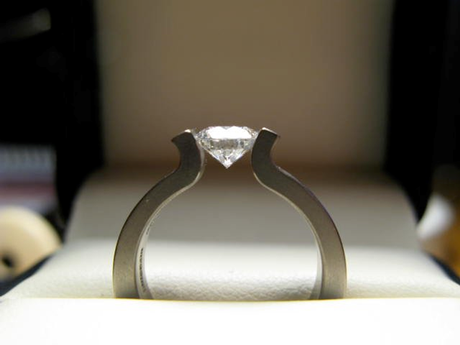 Tension set engagement ring