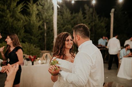 Rustic summer wedding in Nicosia with string lights and flowers in vivid colors | Joy & Pierre