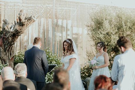 Rustic summer wedding in Nicosia with string lights and flowers in vivid colors | Joy & Pierre