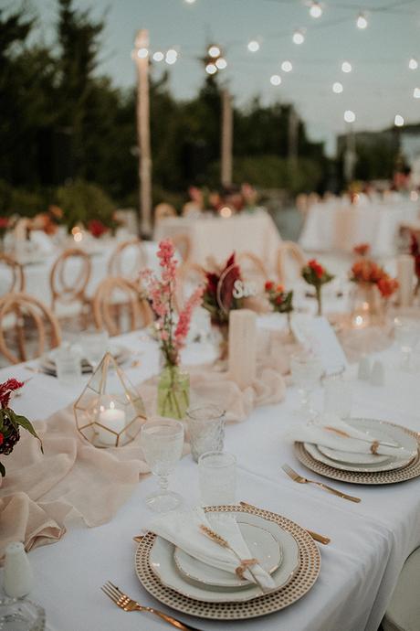 Rustic summer wedding in Nicosia with string lights and flowers in vivid colors | Joy & Pierre