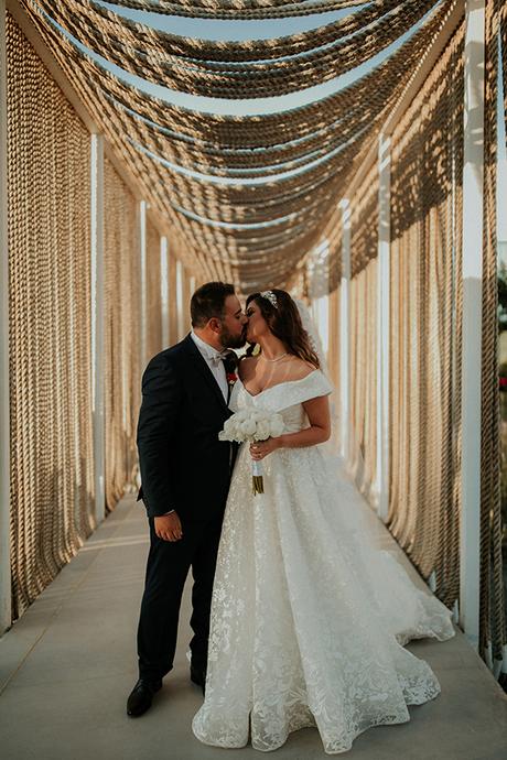 Rustic summer wedding in Nicosia with string lights and flowers in vivid colors | Joy & Pierre