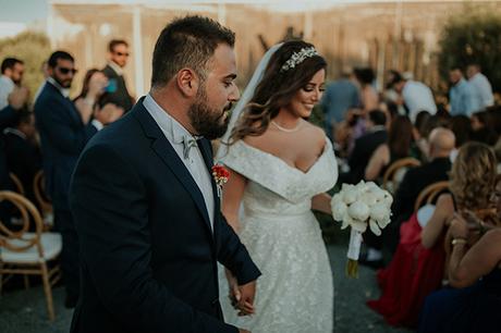 Rustic summer wedding in Nicosia with string lights and flowers in vivid colors | Joy & Pierre